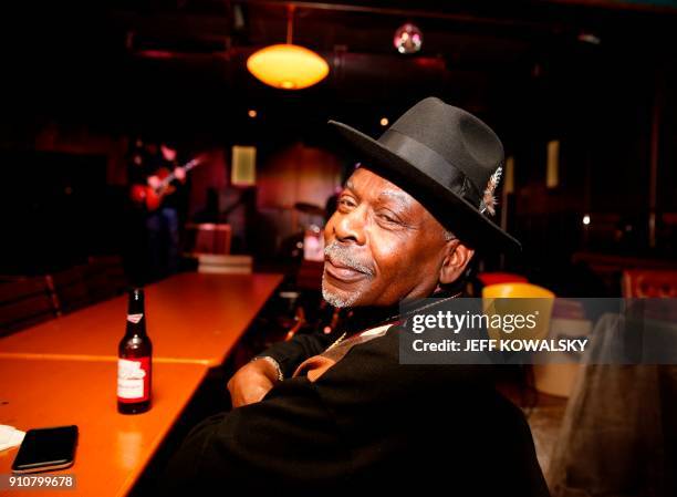 "Smokey" poses at Northern Lights Lounge as he listens to music on January 9, 2018 in Detroit, Michigan. Five years after Detroit declared itself...