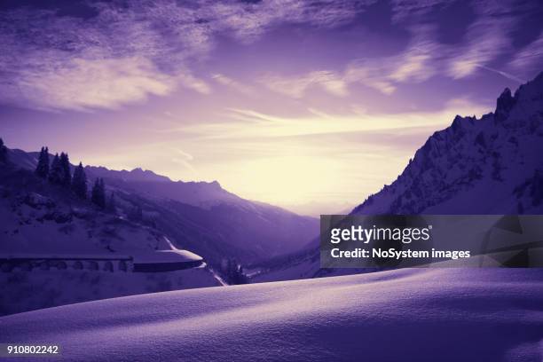 beautiful colorful sunset, st. anton am arlberg ski area, austria. st. anton am arlberg ski area (st. anton, lech, zurs, stuben, st. christoph), located in tyrol, austria on alps. highest peak is valluga 2810m. ski resort is famous for "of slope" skiing. - estância de esqui de zurs imagens e fotografias de stock