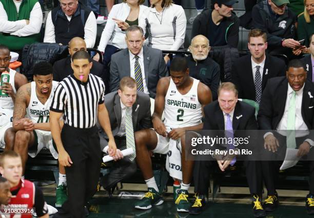 Michigan State Spartans football head coach Mark Dantonio watches the basketball game between the Michigan State Spartans and the Wisconsin Badgers...