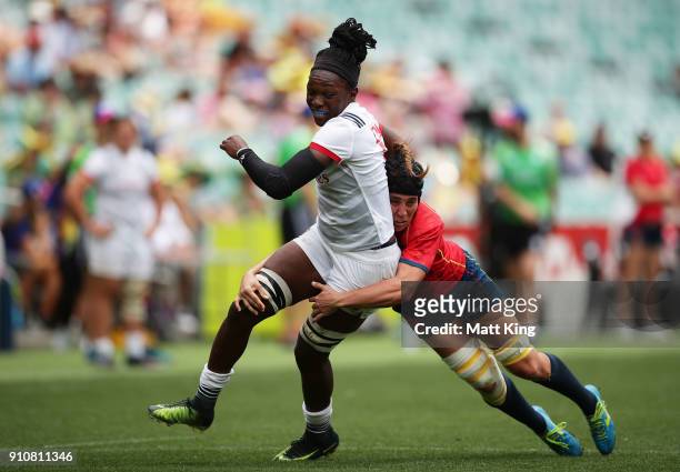 Cheta Emba of the USA is tackled in the game against Spain during day two of the 2018 Sydney Sevens at Allianz Stadium on January 27, 2018 in Sydney,...