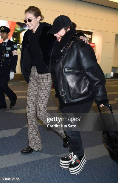 Gigi Hadid and makeup artist Erin Parsons are seen at Haneda Airport on January 27, 2018 in Tokyo, Japan.