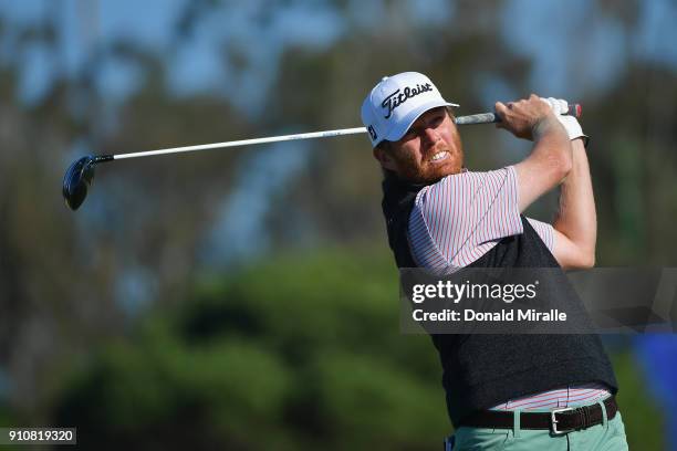 Derek Fathauer plays his shot from the 14th tee during the second round of the Farmers Insurance Open at Torrey Pines North on January 26, 2018 in...