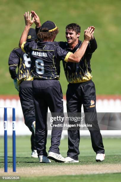 Peter Younghusband of the Firebirds celebrates with Hamish Marshall after taking the wicket of Nick Kelly of Northern Districts during the Ford...