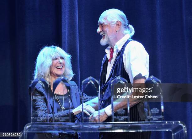 Honorees Christine McVie and Mick Fleetwood of music group Fleetwood Mac accept the MusiCares Person of the Year award onstage during MusiCares...