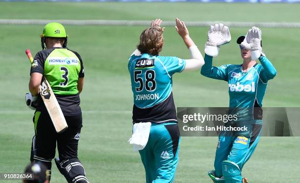 Sammy-Jo Johnson of the Heat celebrates afte taking the wicket of Rachel Priest of the Thunder during the Women's Big Bash League match between the...