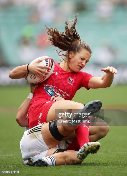 Breanne Nicholas of Canada is tackled in the Cup semi final match against New Zealand during day two of the 2018 Sydney Sevens at Allianz Stadium on...