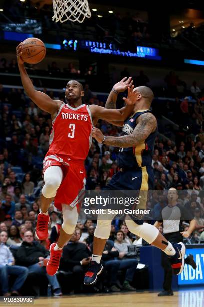 Omer Asik of the New Orleans Pelicans is fouled by Jameer Nelson of the New Orleans Pelicans during the second half at the Smoothie King Center on...