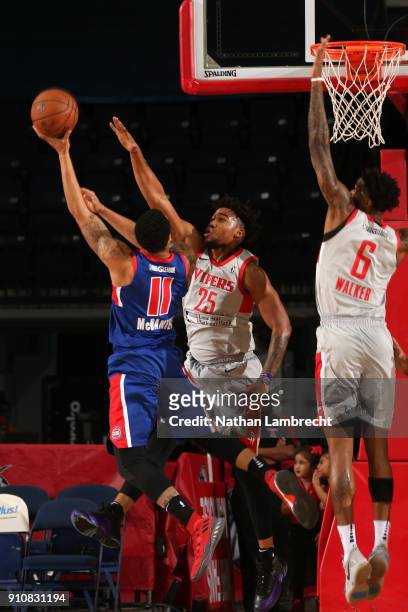 Craig Victor of the Rio Grande Valley Vipers attempts to block the shot of K.J. McDaniels of the Grand Rapids Drive as Chris Walker assists during an...
