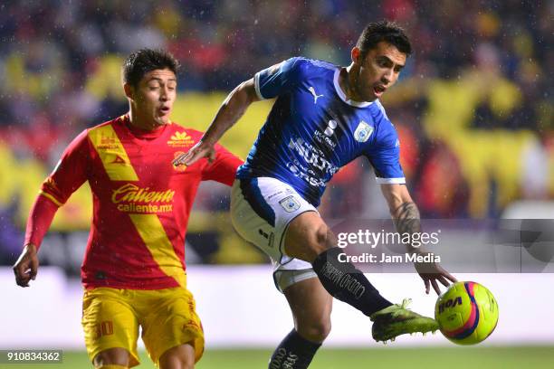 Jorge Valadez of Morelia and Edson Puch of Queretaro fight for the ball during the 4th round match between Monarcas and Queretaro as part of the...