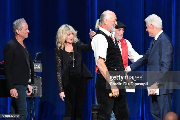 Honorees Lindsey Buckingham, Christine McVie, Mick Fleetwood, John McVie greet former President Bill Clinton onstage during MusiCares Person of the...