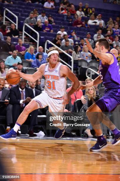 Ron Baker of the New York Knicks handles the ball during the game against the Phoenix Suns on January 26, 2018 at Talking Stick Resort Arena in...