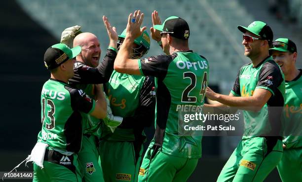 Stars Ben Dunk celebrates with teammates after dismissing Hurricanes D'Arcy Short during the Big Bash League match between the Melbourne Stars and...