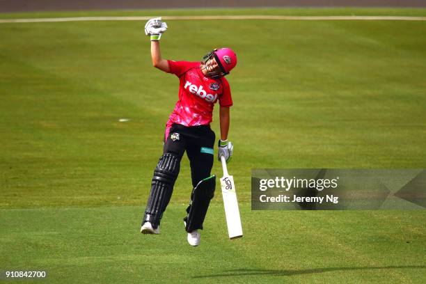 Alyssa Healy of the Sixers celebrates her century during the Women's Big Bash League match between the Adelaide Strikers and the Sydney Sixers at...