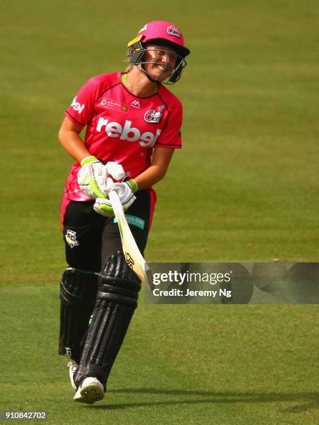 Alyssa Healy of the Sixers celebrates her century during the Women's Big Bash League match between the Adelaide Strikers and the Sydney Sixers at...