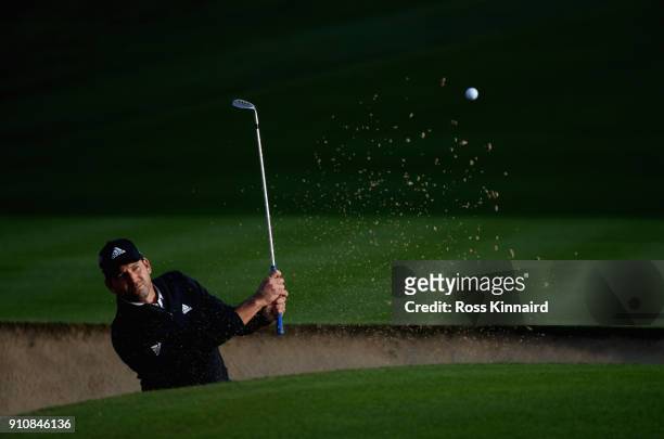 Sergio Garcia of Spain plays his third shot shot on the par four 14th hole during the continuation of the delayed second round of the Omega Dubai...