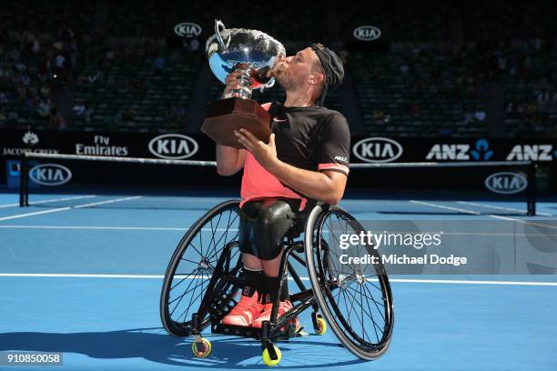 Dylan Alcott of Australia poses with the championship trophy after winning the Quad Wheelchair Singles Final against David Wagner of the United...