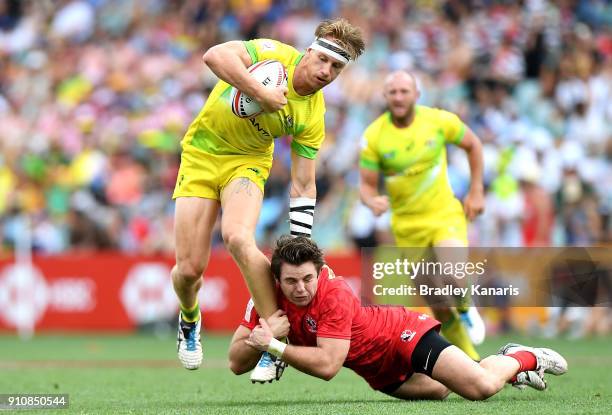 Ben O'Donnell of Australia takes on the defence in the match against Canada during day two of the 2018 Sydney Sevens at Allianz Stadium on January...