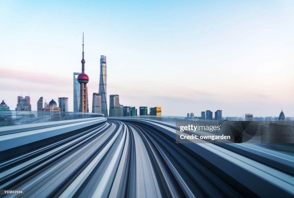 Motion blur of train moving to City