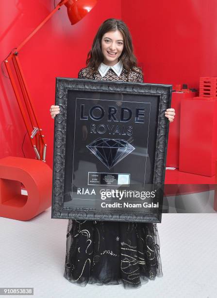 Singer Lorde poses with a plaque commemerating her single "Royals" being RIAA Diamond certification as Republic Records Celebrates the GRAMMY Awards...