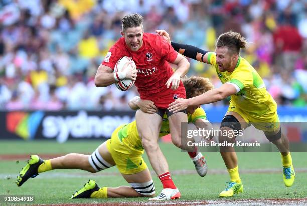 Isaac Kaay of Canada attempts to break through the defence in the match against Australia during day two of the 2018 Sydney Sevens at Allianz Stadium...