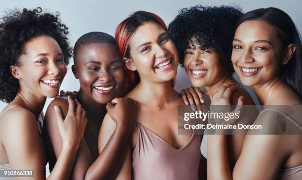 our differences don’t divide us, they unite us - multiracial group beauty stock pictures, royalty-free photos & images