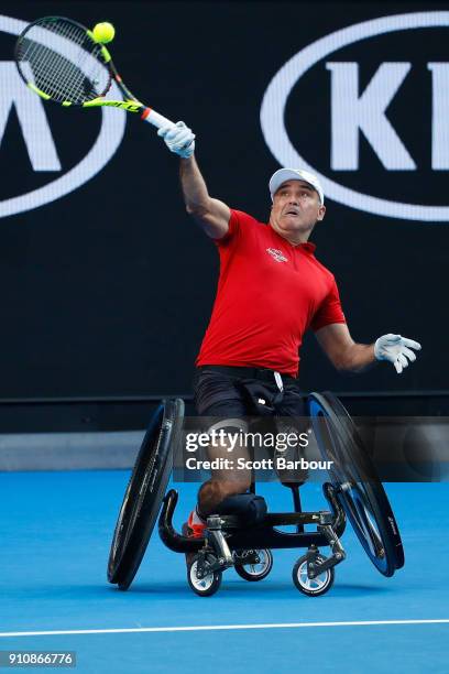 Stephane Houdet of France plays a forehand in his men's wheelchair singles final against Shingo Kunieda of Japan during the Australian Open 2018...