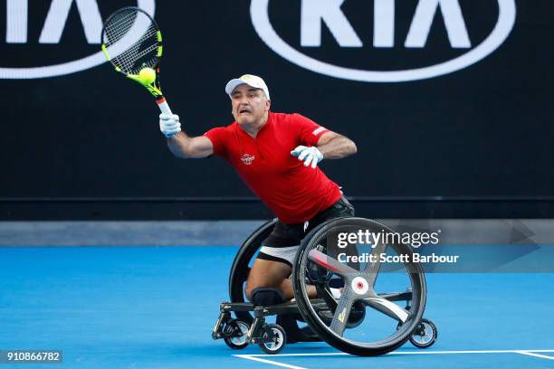 Stephane Houdet of France plays a forehand in his men's wheelchair singles final against Shingo Kunieda of Japan during the Australian Open 2018...