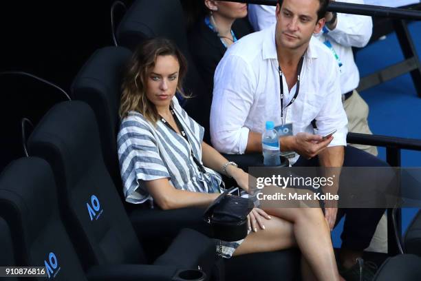 Australian actress Jessica McNamee watches the women's singles final between Caroline Wozniacki of Denmark and Simona Halep of Romania on day 13 of...