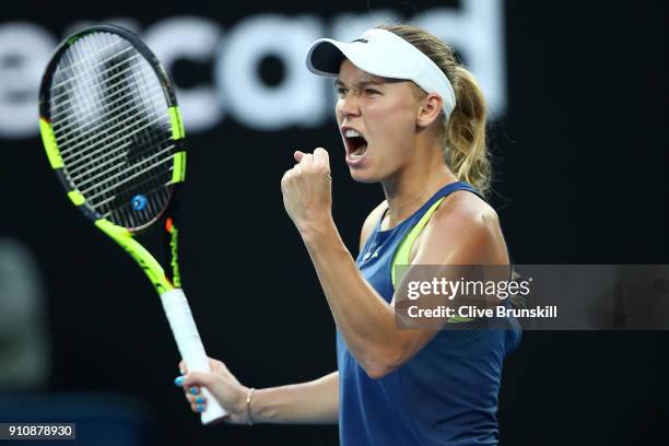 Caroline Wozniacki of Denmark celebrates winning a point in her women's singles final against Simona Halep of Romania on day 13 of the 2018...