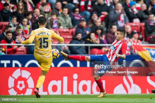Angel Correa of Atletico de Madrid fights for the ball with Juan Pedro Ramirez Lopez, Juanpe, of Girona FC during the La Liga 2017-18 match between...