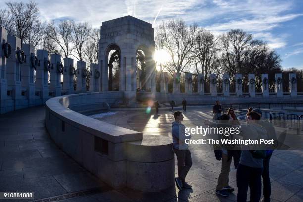 Visitors gather at the World War II Memorial on Saturday, January 20 in Washington, DC. The memorial is open during this federal government shutdown,...