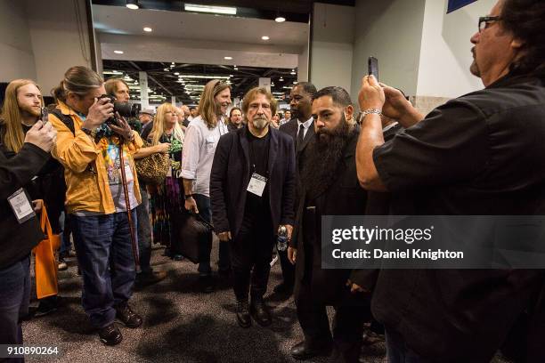 Bassist Geezer Butler of Black Sabbath signs autographs at The 2018 NAMM Show at Anaheim Convention Center on January 26, 2018 in Anaheim, California.