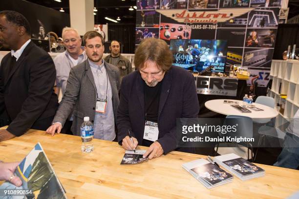 Bassist Geezer Butler of Black Sabbath signs autographs at The 2018 NAMM Show at Anaheim Convention Center on January 26, 2018 in Anaheim, California.