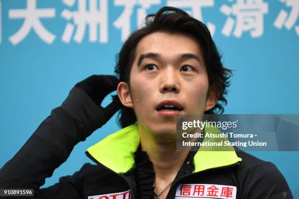 Takahito Mura of Japan looks on at kiss and cry after competing in the men free skating during day four of the Four Continents Figure Skating...