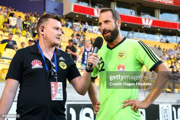 Andrew Durante of the Phoenix talks to David Rybinski prior to a presentation to recognise his 278th game, which ties the A-League record, during the...