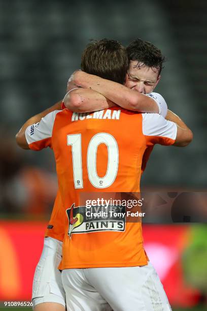 Brett Holman of the Roar celebrates a goal with team mate Daniel Leck during the round 18 A-League match between the Central Coast Mariners and the...