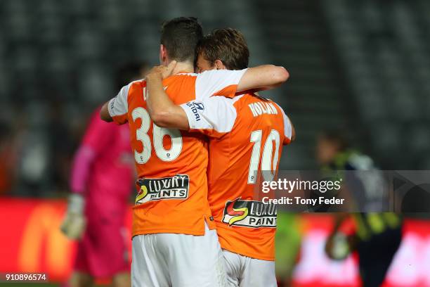 Brett Holman of the Roar celebrates a goal with team mate Daniel Leck during the round 18 A-League match between the Central Coast Mariners and the...