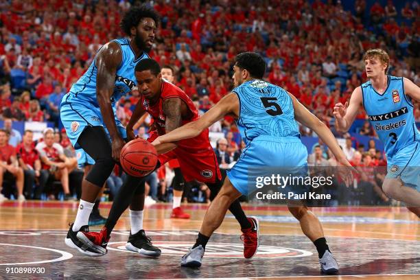 Bryce Cotton of the Wildcats drives thru Rakeem Christmas and Shea Ili of the Breakers during the round 16 NBL match between the Perth Wildcats and...