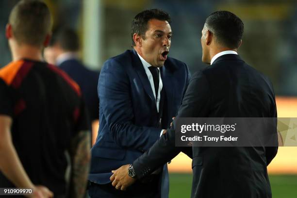 Paul Okon of the Mariners and John Aloisi of the Roar in discussion after the game during the round 18 A-League match between the Central Coast...