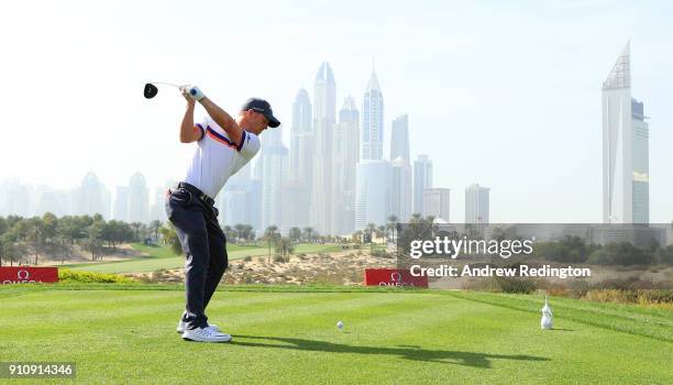 David Horsey of England tees off on the 8th hole with the city as a backdrop during day three of Omega Dubai Desert Classic at Emirates Golf Club on...