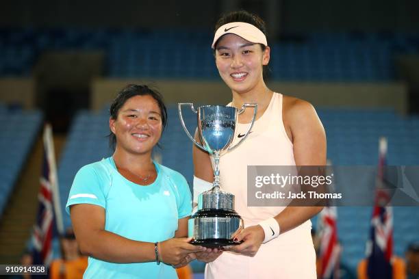 En Shuo Liang of Taipei and Xinyu Wang of China pose for a photo with the championship trophy after winning the Junior Girls' Doubles Final at the...