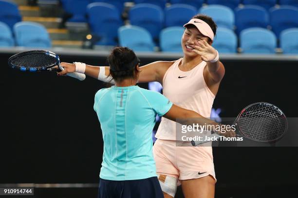 En Shuo Liang of Taipei and Xinyu Wang of China celebrate after winning the Junior Girls' Doubles Final against Violet Apisah of Papua New Guinea and...