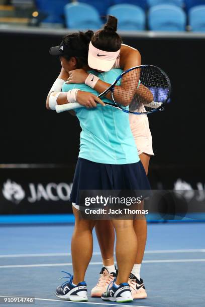 En Shuo Liang of Taipei and Xinyu Wang of China celebrate after winning the Junior Girls' Doubles Final against Violet Apisah of Papua New Guinea and...