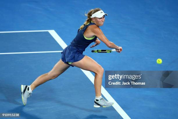 Caroline Wozniacki of Denmark plays a backhand in her women's singles final against Simona Halep of Romania on day 13 of the 2018 Australian Open at...
