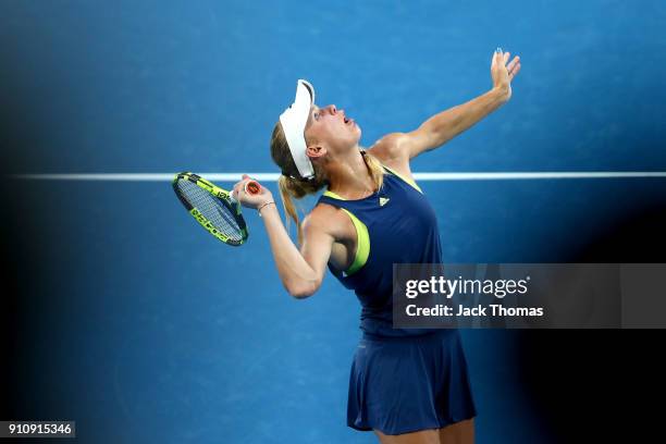 Caroline Wozniacki of Denmark serves in her women's singles final against Simona Halep of Romania on day 13 of the 2018 Australian Open at Melbourne...