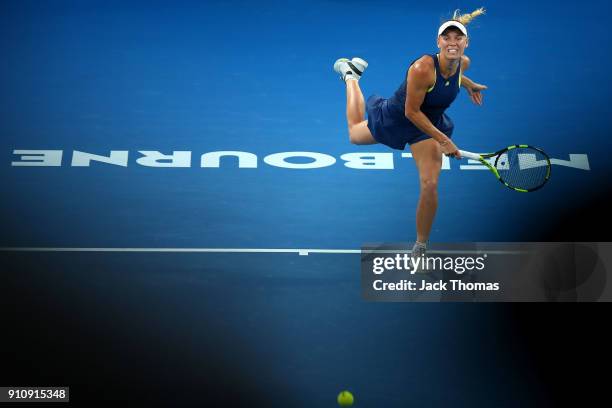 Caroline Wozniacki of Denmark serves in her women's singles final against Simona Halep of Romania on day 13 of the 2018 Australian Open at Melbourne...