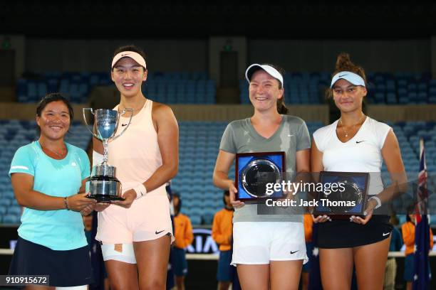 En Shuo Liang of Taipei and Xinyu Wang of China pose for a photo with the championship trophy after winning the Junior Girls' Doubles Final against...
