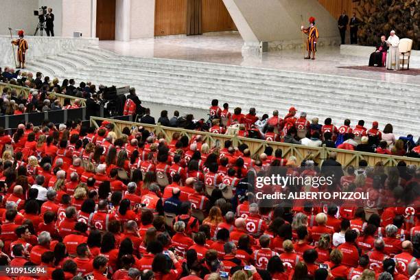 Pope Francis speaks during an audience with members of the Italian Red Cross and Red Crescent in the Paul VI hall at the Vatican on January 27, 2018.