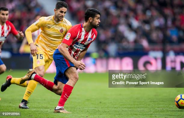Diego Costa of Atletico de Madrid is followed by Juan Pedro Ramirez Lopez, Juanpe, of Girona FC during the La Liga 2017-18 match between Atletico de...