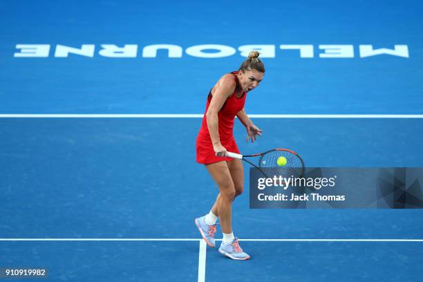 Simona Halep of Romania plays a backhand in her women's singles final against Caroline Wozniacki of Denmark on day 13 of the 2018 Australian Open at...